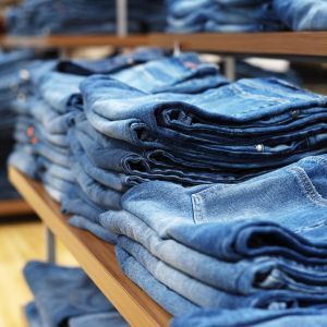 jeans on shelves in a clothing store