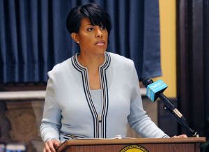 Baltimore mayor seeks US probe of police; governor lifts emergency