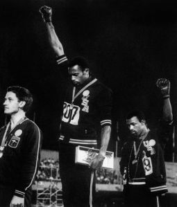 US athletes Tommie Smith (C) and John Ca