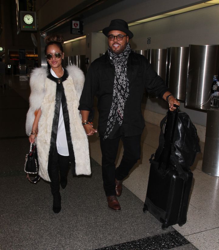 Adrienne Bailon and her fiancé Israel Houghton depart from Los Angeles International Airport (LAX)